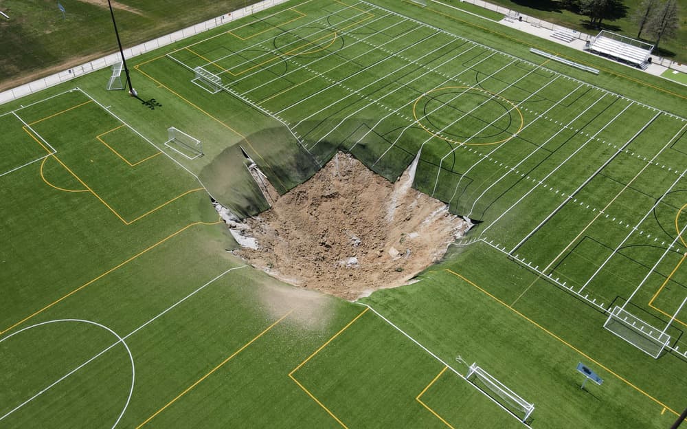 A sinkhole forms on a soccer field in Illinois